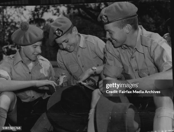 Exams over, 340 cadets from Scots College left Sydney yesterday to attend military camp for a week at Singleton. From left, Jim Moore, Charles O'Neil...