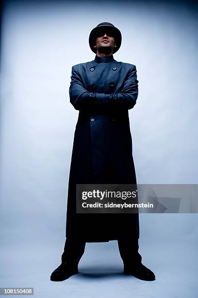 don't mess.... - trenchcoat stockfoto's en -beelden