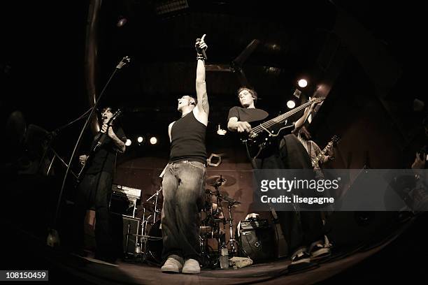 band performing on stage, fisheye - rock music band stock pictures, royalty-free photos & images
