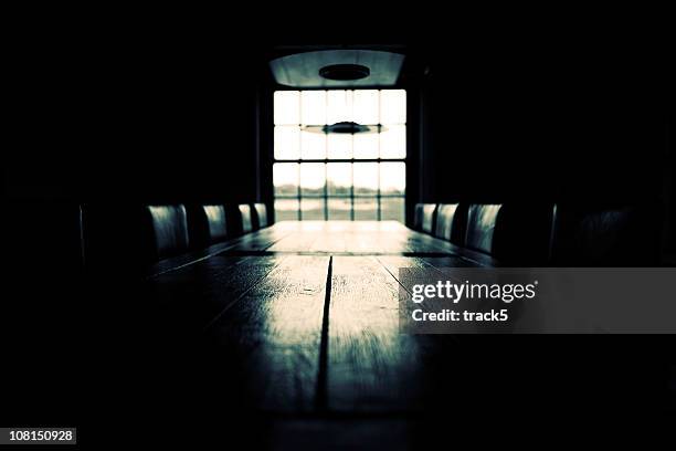 low key empty boardroom scene; black and white - skjutfönster bildbanksfoton och bilder