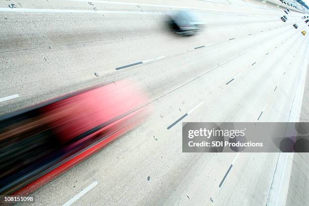 motion blur of fast cars on highway - fast motion stock pictures, royalty-free photos & images