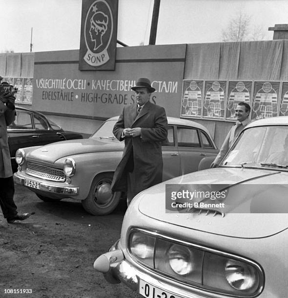 Former Montreal Canadiens star Maurice Richard walks through a car lot circa 1960's in the former Czechoslovakia.