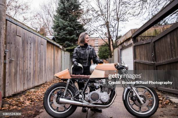 woman in an alley way with her motorcycle - motorized vehicle riding stock pictures, royalty-free photos & images