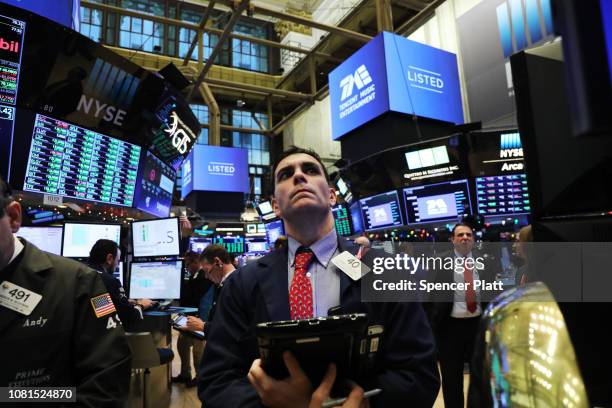Traders work on the floor on the New York Stock Exchange as the Chinese music-streaming service Tencent Music launches its IPO on December 12, 2018...
