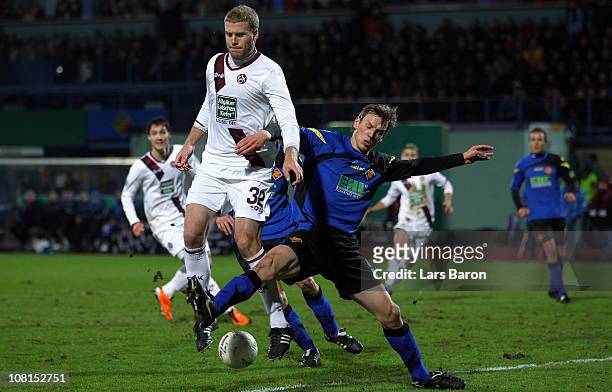 Adam Nemec of Kaiserslautern is challenged by Ole Kittner of Koblenz during the DFB Cup round of sixteen match between TuS Koblenz and 1. FC...