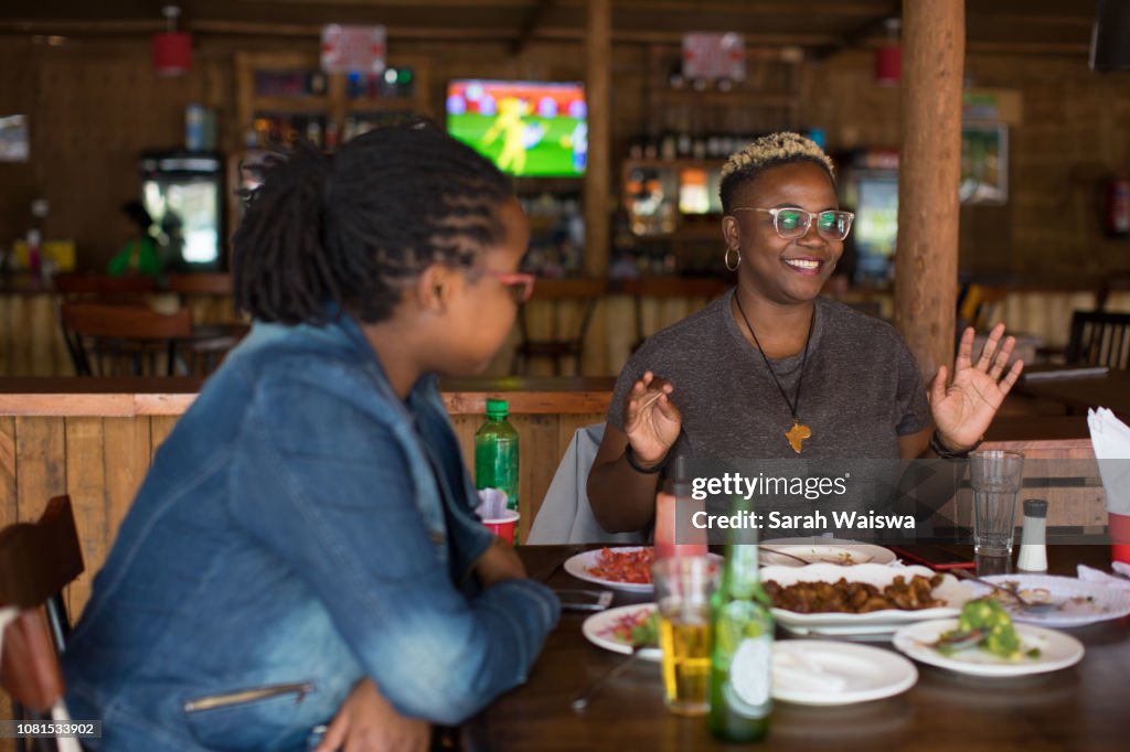 Black woman at lunch with friends