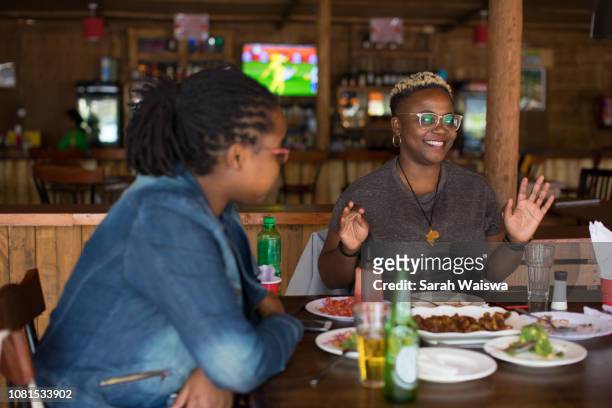 Black woman at lunch with friends