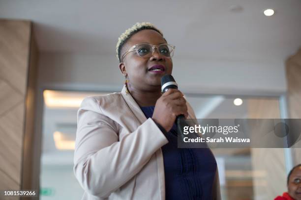 portrait of black business speaking at a conference - woman microphone stock pictures, royalty-free photos & images