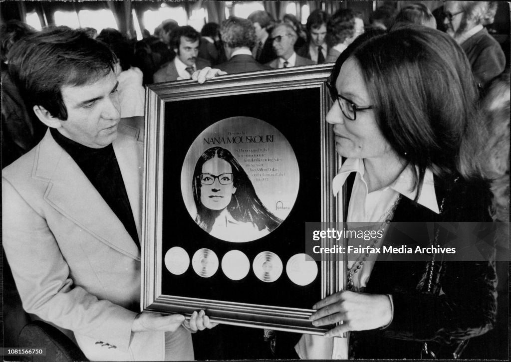 Nana Mouskouri Gold Record Presentation: Nana and Husband George with her Gold Record at the Caprice this afternoon after the presentation.Nana Mouskouri was this afternoon presented with a gold record at the Caprice Restaurant Rose Bay.