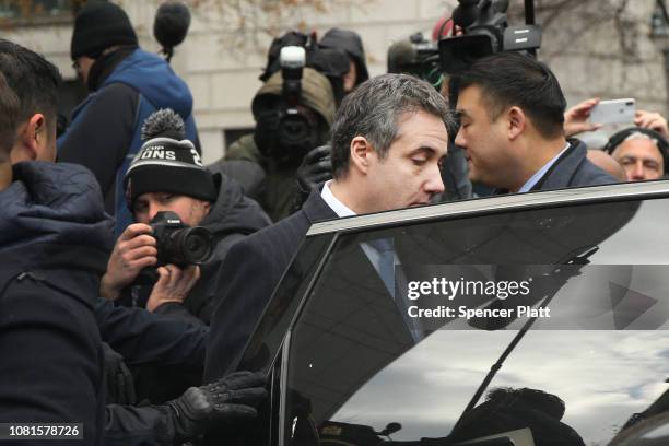 Michael Cohen, President Donald Trump's former personal attorney and fixer, walks out of a federal courthouse in Manhattan on December 12, 2018 in...