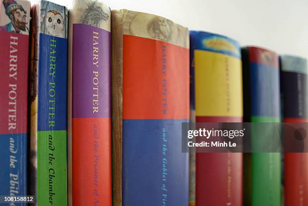 All seven harry potter books stacked next to each other.