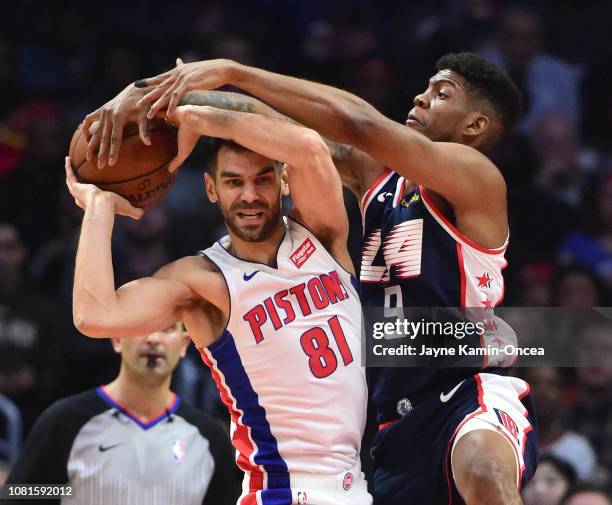 Tyrone Wallace of the Los Angeles Clippers defends Jose Calderon of the Detroit Pistons as he tries to make a pass in the first half of the game at...