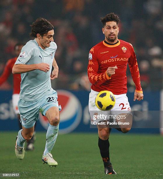 Marco Borriello of AS Roma competes for the ball with Giuseppe Biava of SS Lazio during the Tim Cup match between AS Roma and SS Lazio at Stadio...