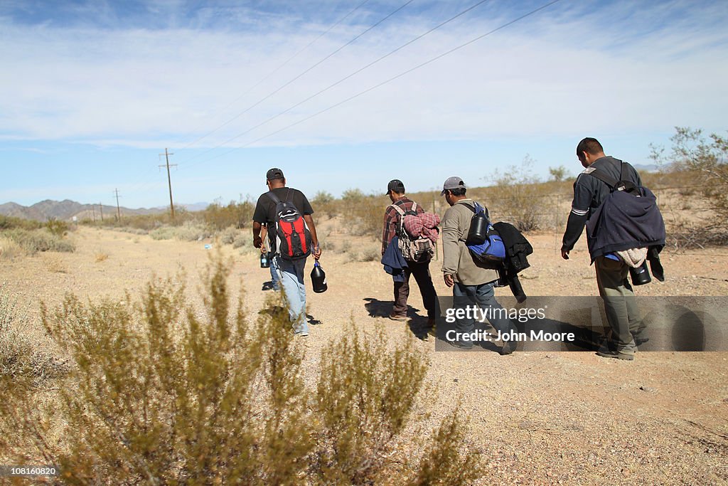 Undocumented Immigrants Cross Into The United States From Mexico