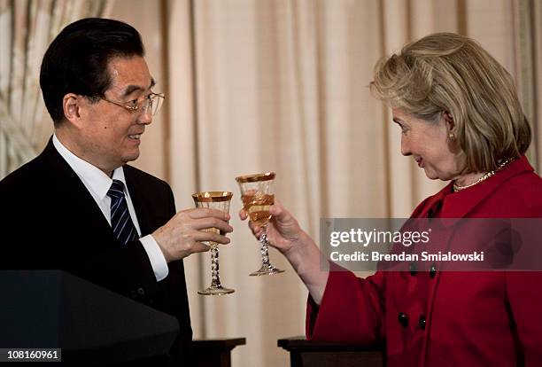 Chinese President Hu Jintao and U.S. Secretary of State Hillary Rodham Clinton toast during a luncheon at the U.S. State Department 19, 2011 in...