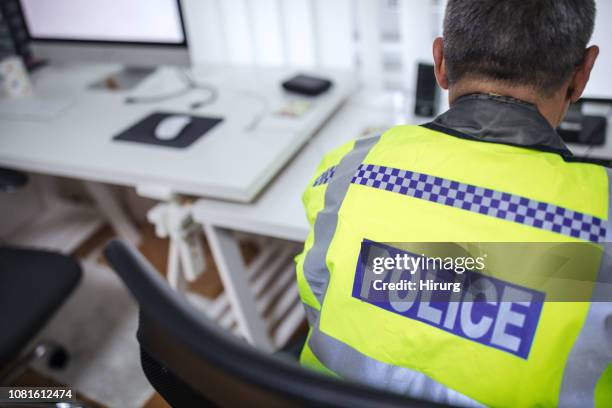 traffic officer sitting at the desk - police serbia stock pictures, royalty-free photos & images