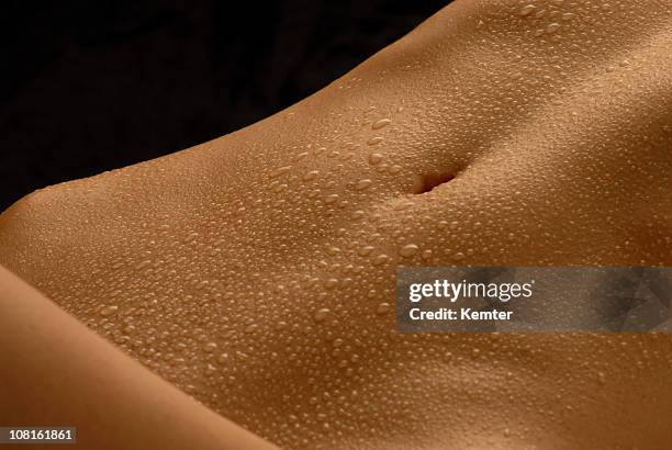 abdomen with waterdrops - hot glamour models stock pictures, royalty-free photos & images