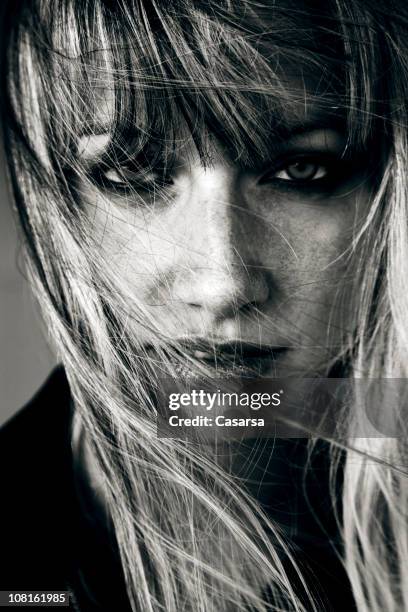 portrait of young woman, black and white - wind swept face stock pictures, royalty-free photos & images