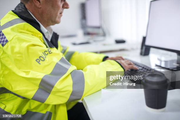 senior traffic officer writes a report - uk police officer stock pictures, royalty-free photos & images