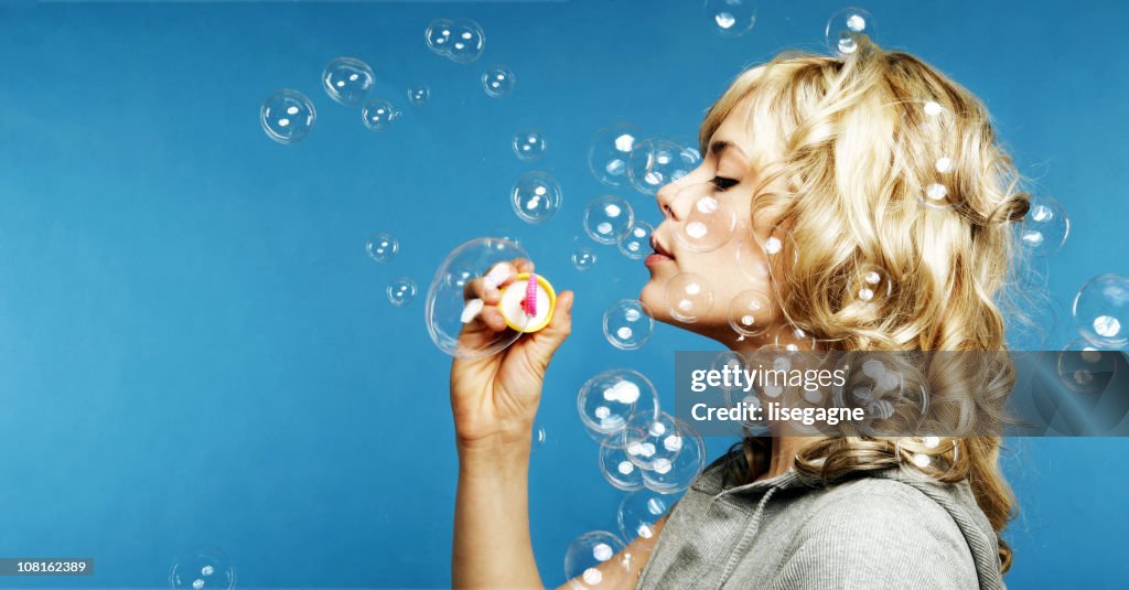 Woman making bubbles