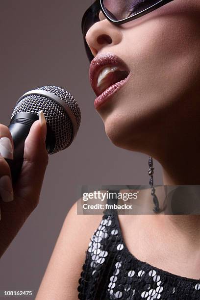 Rapper Holding Microphone Photos and Premium High Res Pictures - Getty ...