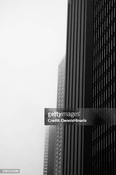 black and white of chicago buildings in fog - chicago black and white stock pictures, royalty-free photos & images