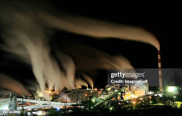 industrial factory at night - paper mill stock pictures, royalty-free photos & images
