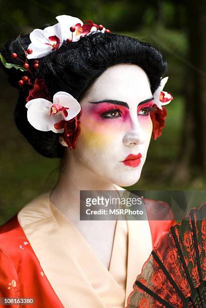 young woman wearing geisha costume - folding fan stock pictures, royalty-free photos & images