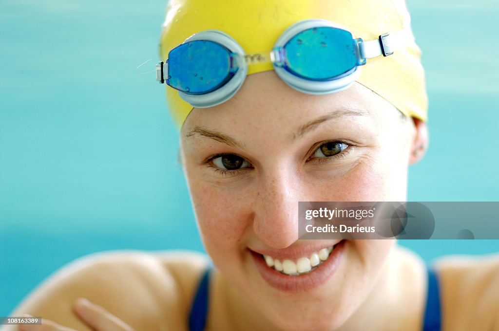 Portrait of Woman Wearing Swimming Cap and Goggles