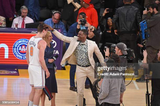 Retired NBA Player Royal Ivey greets Mario Hezonja of the New York Knicks after the game against the Los Angeles Lakers on January 4, 2019 at STAPLES...
