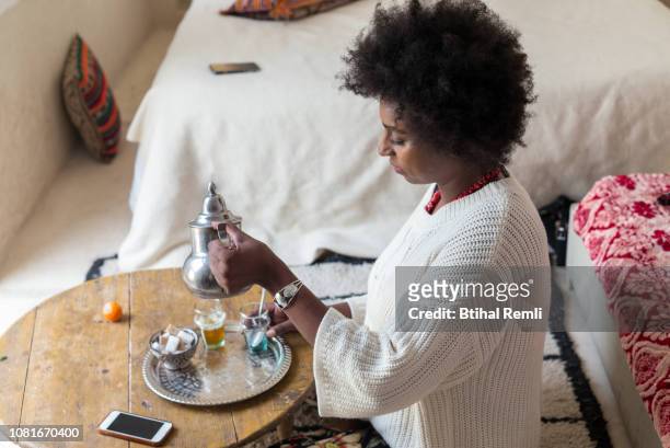 Woman pouring moroccan mint tea