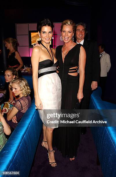 Angie Harmon and Rebecca Romijn during 2005 InStyle/Warner Bros. Golden Globes Party - Inside at The Palm Court at the Beverly Hilton in Beverly...