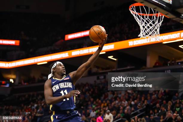 Jrue Holiday of the New Orleans Pelicans goes up for a layup in the first quarter against the Minnesota Timberwolves at Target Center on January 12,...
