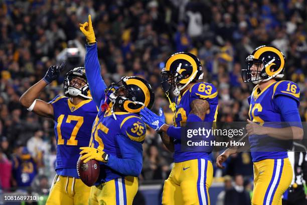 Anderson of the Los Angeles Rams celebrates with teammates after scoring a 1 yard touchdown in the second quarter against the Dallas Cowboys in the...