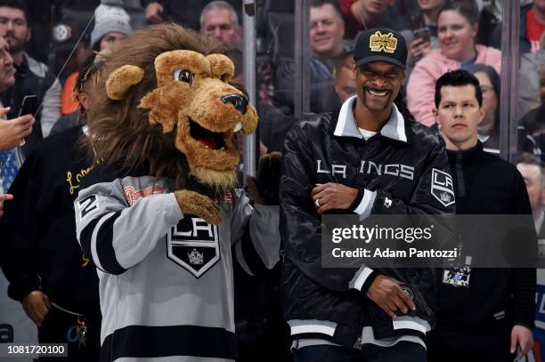 Multi-platinum artist, actor, philanthropist and entertainment icon Snoop Dogg jokes with Los Angeles Kings' mascot Bailey as he waits for a...