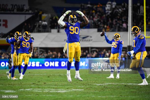 Defensive end Michael Brockers of the Los Angeles Rams celebrates after stopping the Dallas Cowboys' fourth down in the fourth quarter of the NFC...