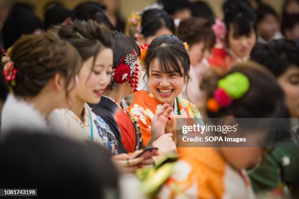 People women wearing kimonos during the ceremony. 1.25 million People celebrated their passage into adulthood on the Coming of Age Day, a Japanese...