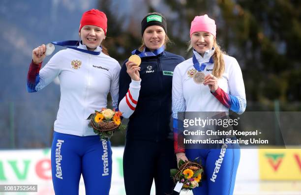 Olga Fatkulina of Russiat poses during the medal ceremony after winning the 2nd place, Vanessa Herzog of Austria poses during the medal ceremony...
