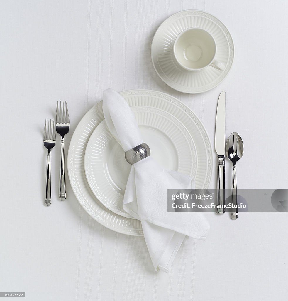 White Table Place Setting with Dishes