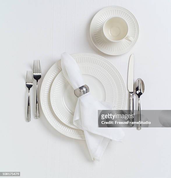 white table place setting with dishes - napkin stock pictures, royalty-free photos & images