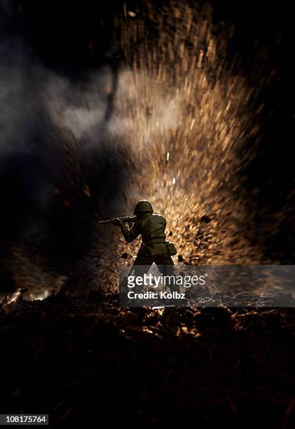 toy soldier in  front of explosion - vietnam war stock pictures, royalty-free photos & images