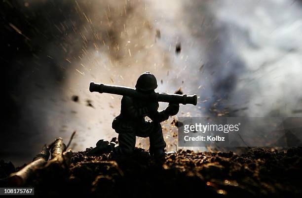 toy soldier fires a rocket launcher under attack - vietnam war stock pictures, royalty-free photos & images