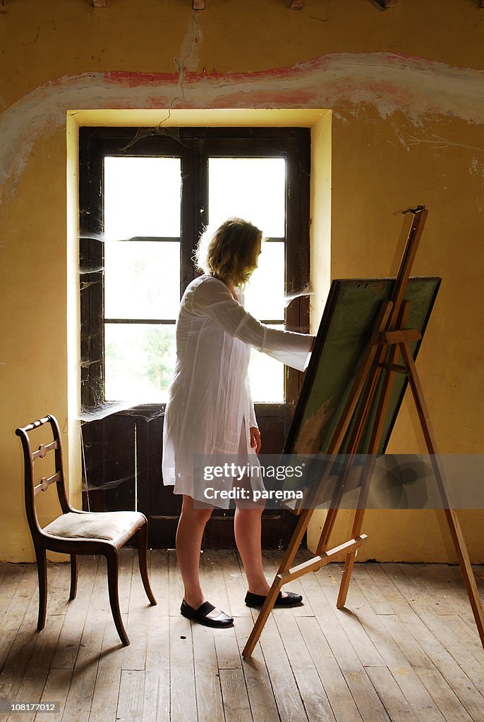 Woman Painting in Room