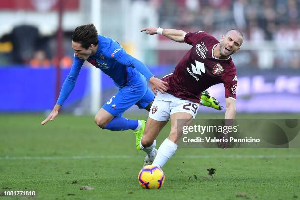 Lorenzo De Silvestri of Torino FC clashes with Federico Chiesa of ACF Fiorentina during the Coppa Italia match between Torino FC and ACF Fiorentina...