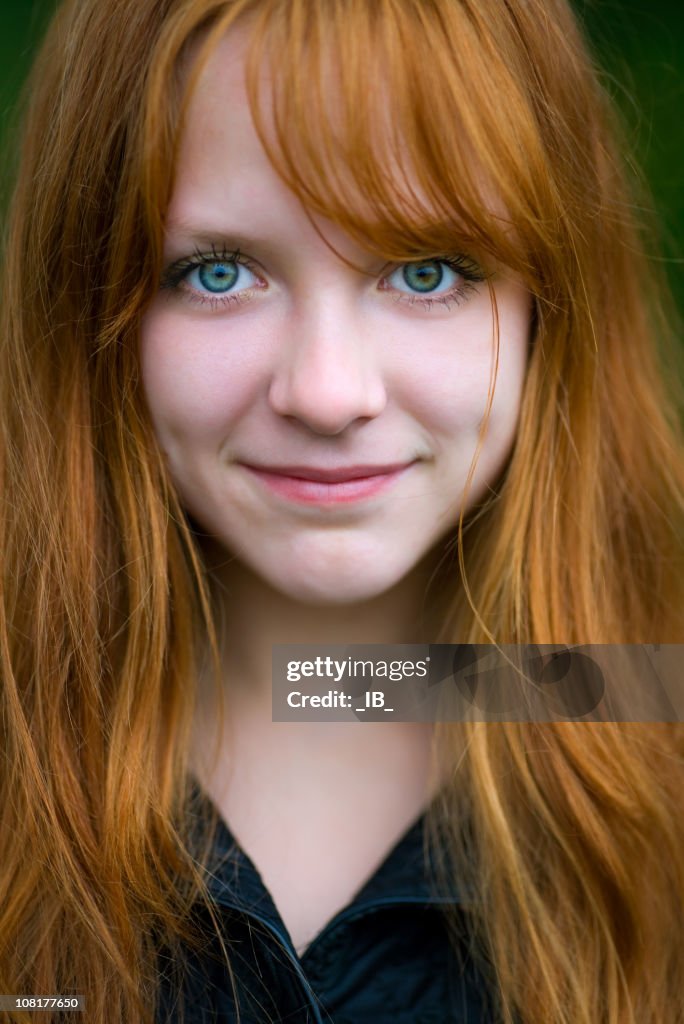 Head Shot of Young Red Headed Woman Staring Ahead