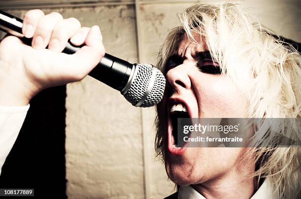 punk singer. - female open mouth stock pictures, royalty-free photos & images