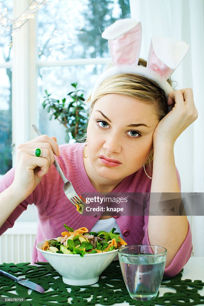 Young Woman Eating Salad