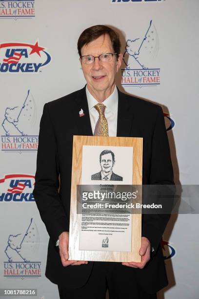 David Poile poses with his Hall of Fame plaque at the U.S. Hockey Hall Of Fame Induction on December 12, 2018 in Nashville, Tennessee.