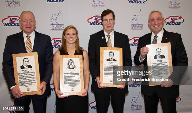 Gordon "Red" Berenson, Natalie Darwitz, David Poile, and Paul Stewart pose with their Hall of Fame plaques at the U.S. Hockey Hall Of Fame Induction...