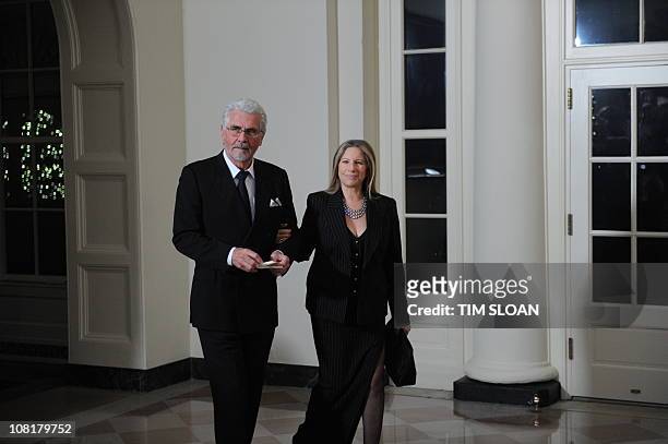 Singer Barbra Streisand and her husband actor James Brolin arrive for the State Dinner in honor of Chinese President Hu on January 19, 2011 at the...
